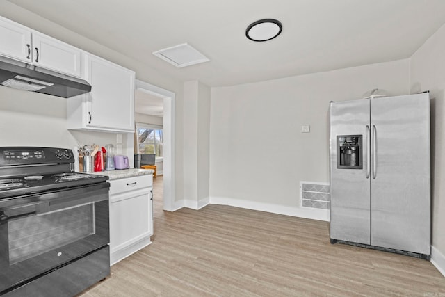 kitchen featuring white cabinetry, stainless steel fridge, light hardwood / wood-style flooring, and black electric range oven