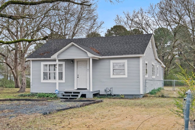 bungalow-style home featuring a front yard