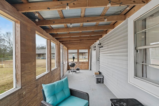 unfurnished sunroom featuring plenty of natural light