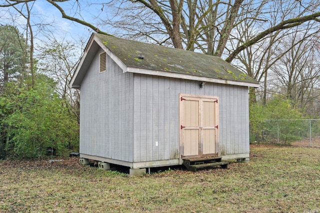 view of outdoor structure with a lawn