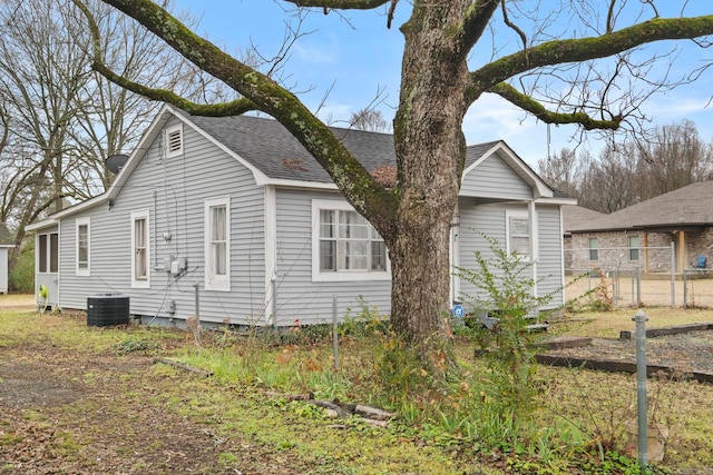 view of property exterior with central AC