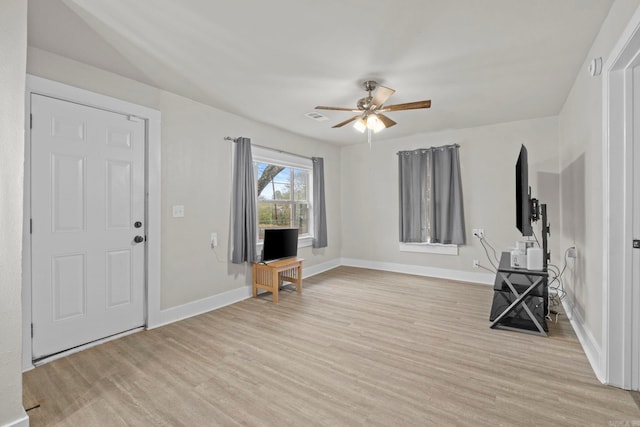 foyer entrance with light hardwood / wood-style flooring and ceiling fan