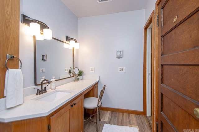 bathroom featuring wood-type flooring and vanity