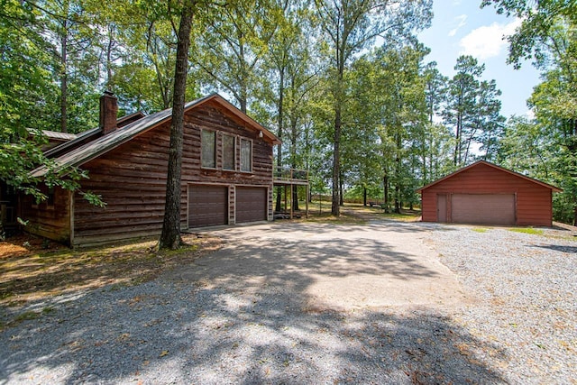 view of side of home with a garage