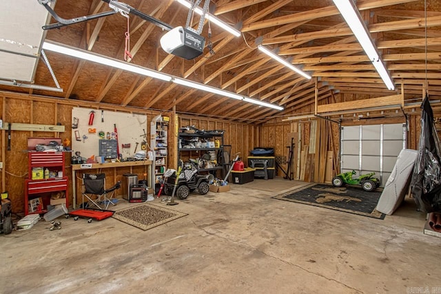 garage featuring a workshop area and a garage door opener