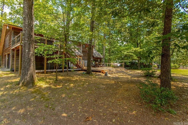 view of yard featuring a wooden deck