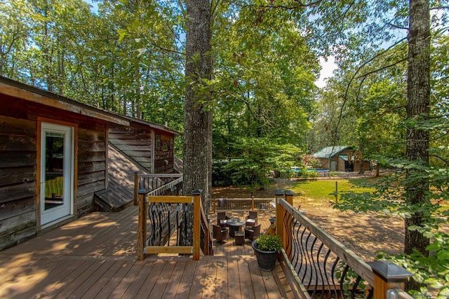 wooden terrace with a shed