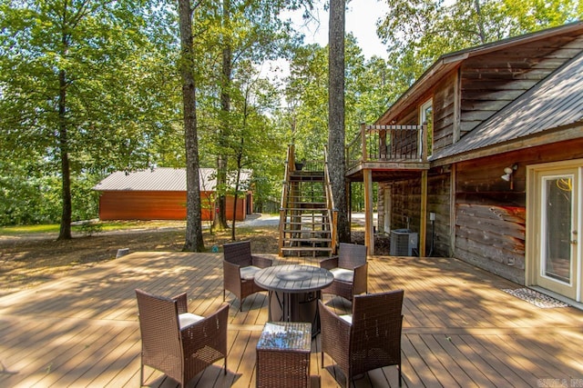 wooden deck with central air condition unit