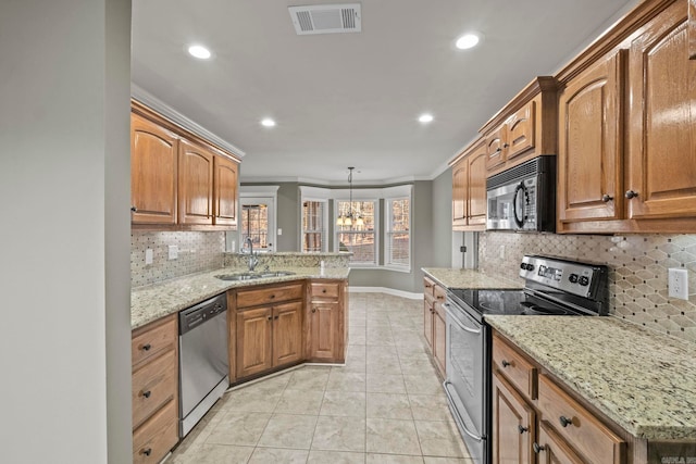 kitchen with light stone countertops, sink, hanging light fixtures, stainless steel appliances, and crown molding