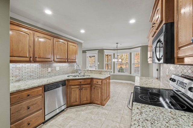 kitchen featuring backsplash, sink, stainless steel appliances, and decorative light fixtures