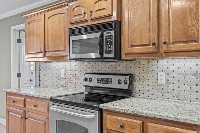 kitchen with light stone countertops, electric range, tasteful backsplash, and ornamental molding