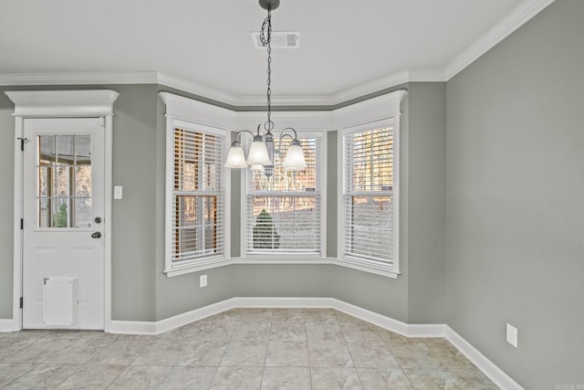 unfurnished dining area featuring a chandelier, crown molding, and light tile patterned flooring