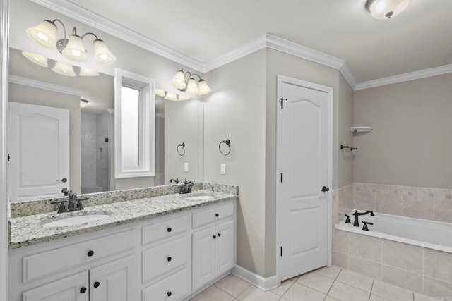 bathroom featuring tile patterned floors, vanity, ornamental molding, and tiled tub