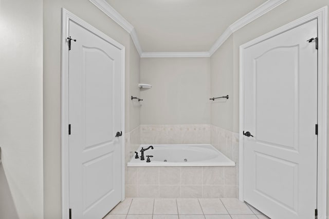 bathroom featuring tile patterned floors, crown molding, and tiled tub