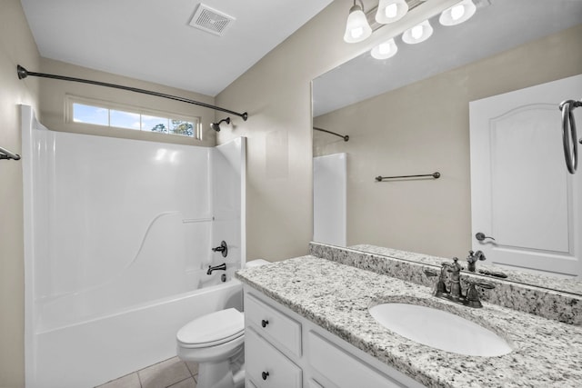 full bathroom with tile patterned floors, vanity, shower / bath combination, and toilet