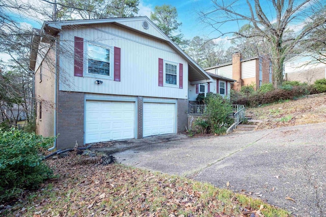 view of side of home featuring a garage