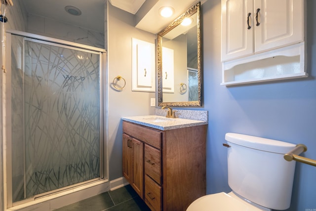 bathroom featuring toilet, tile patterned flooring, vanity, and walk in shower