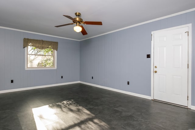 spare room featuring ceiling fan and ornamental molding