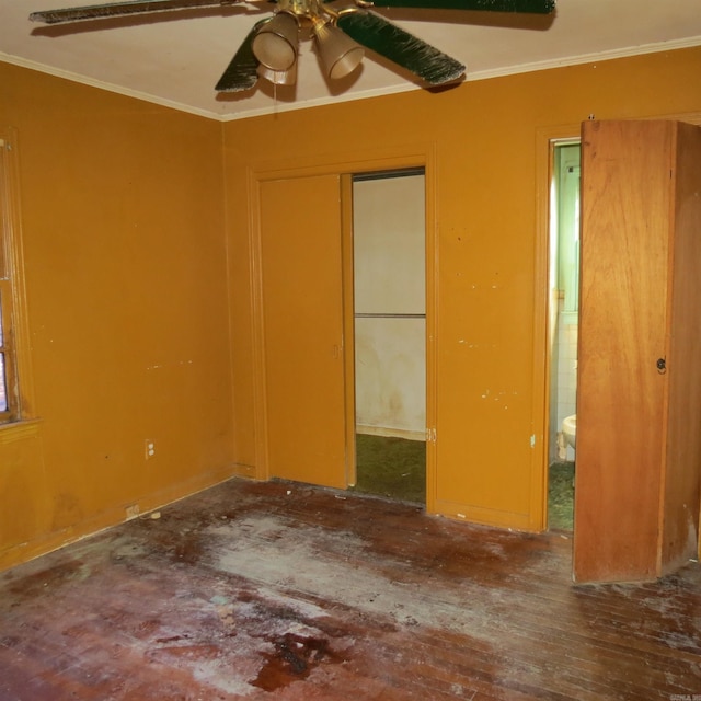 unfurnished room with hardwood / wood-style flooring and ornamental molding