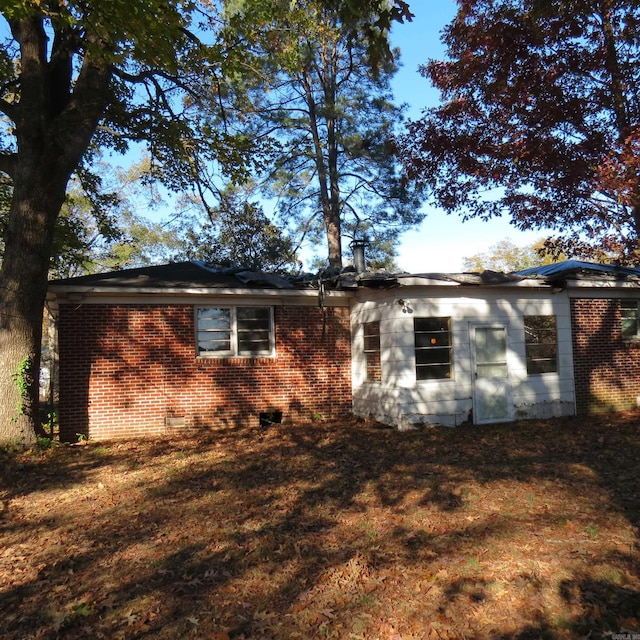 rear view of house with a lawn