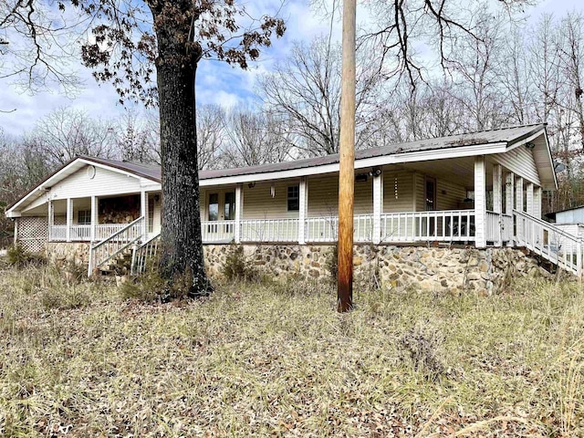 back of house with covered porch