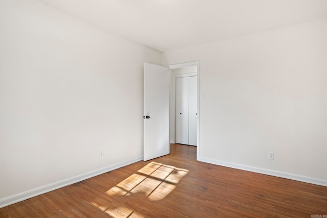 unfurnished room featuring hardwood / wood-style floors