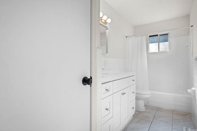 full bathroom with vanity, toilet, and shower / bath combo with shower curtain