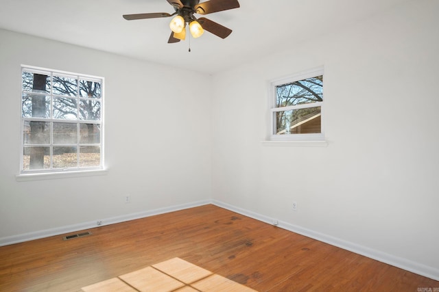 spare room featuring ceiling fan and light hardwood / wood-style floors