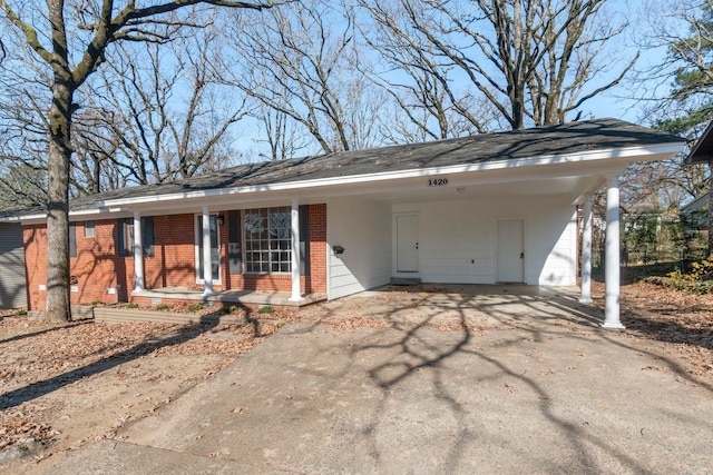 ranch-style house with a carport