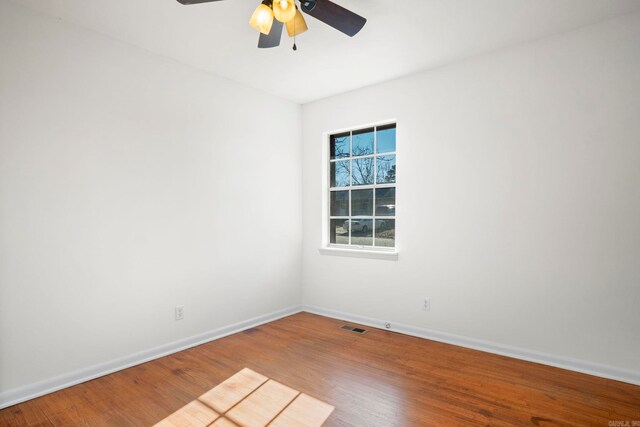 unfurnished room featuring hardwood / wood-style flooring and ceiling fan