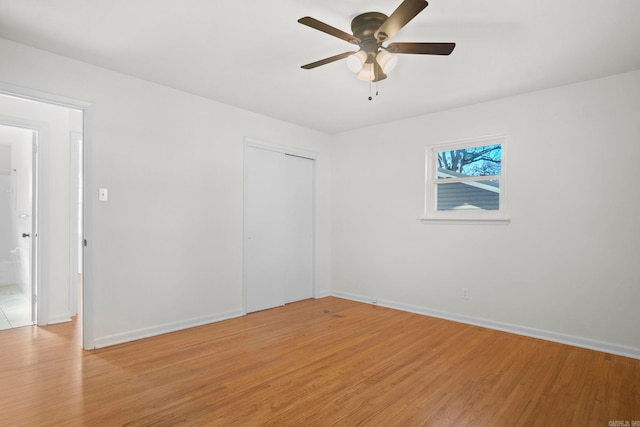 spare room featuring ceiling fan and light hardwood / wood-style flooring