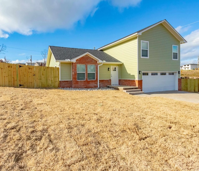 view of front of property with a garage