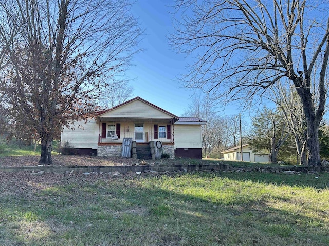 view of front of property with a porch and a front lawn