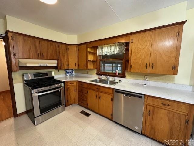 kitchen with sink and appliances with stainless steel finishes