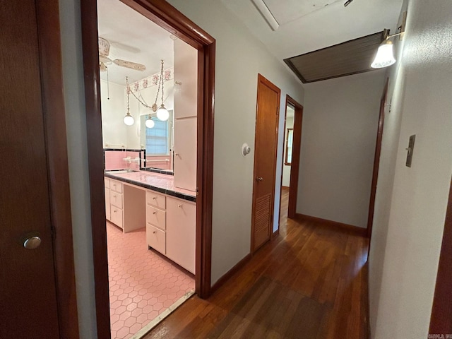 hallway featuring dark hardwood / wood-style flooring