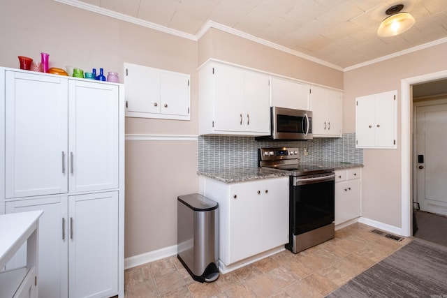 kitchen with light stone countertops, backsplash, appliances with stainless steel finishes, white cabinets, and ornamental molding