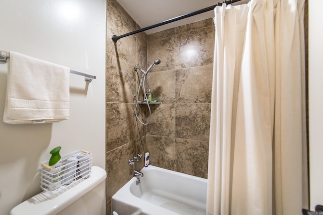 bathroom featuring shower / tub combo with curtain and toilet