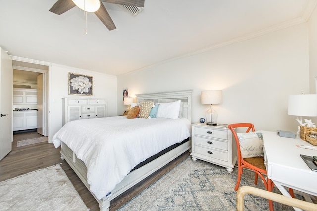 bedroom featuring ceiling fan, wood-type flooring, and crown molding