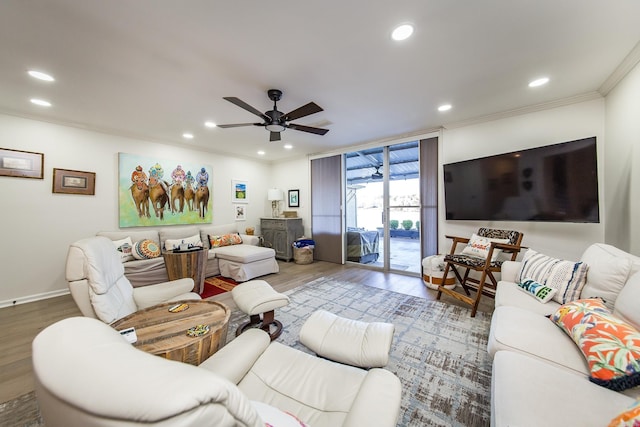 living room with ceiling fan, ornamental molding, and hardwood / wood-style flooring