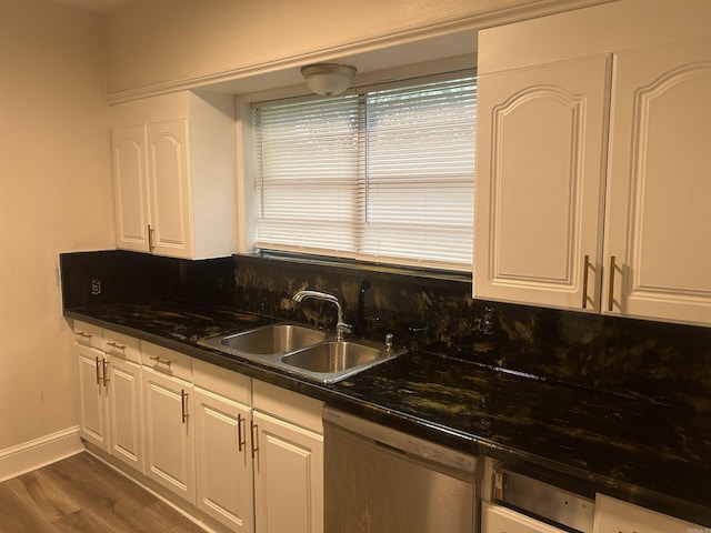 kitchen featuring dark hardwood / wood-style flooring, white cabinets, tasteful backsplash, sink, and dishwasher