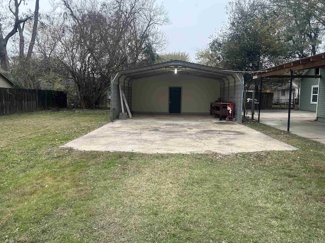 exterior space featuring a carport and a yard