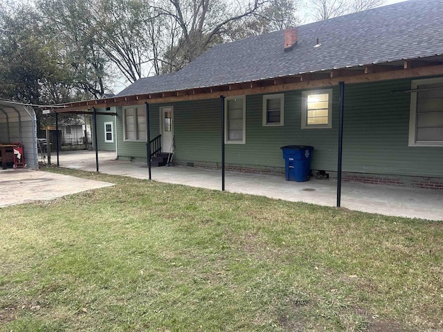 back of house featuring a yard