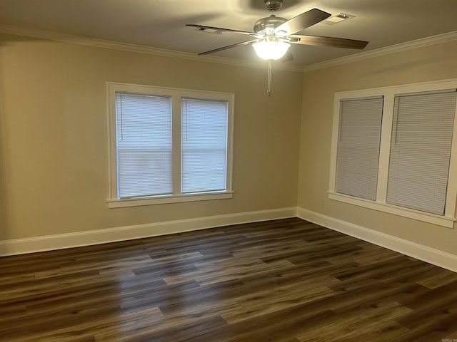 empty room featuring dark hardwood / wood-style floors, ceiling fan, and ornamental molding