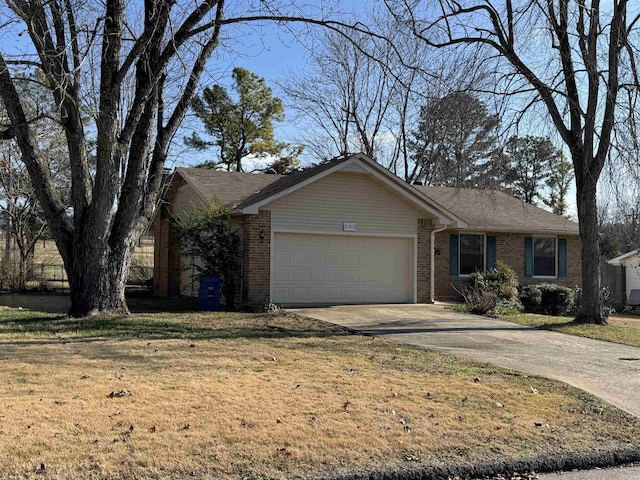 ranch-style home featuring a front lawn and a garage