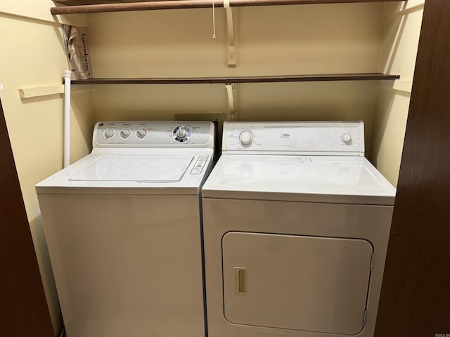 clothes washing area with independent washer and dryer