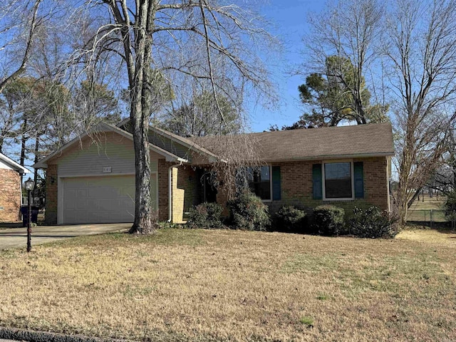 ranch-style home featuring a front lawn and a garage