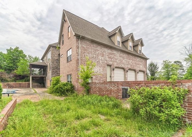 view of side of property featuring a garage