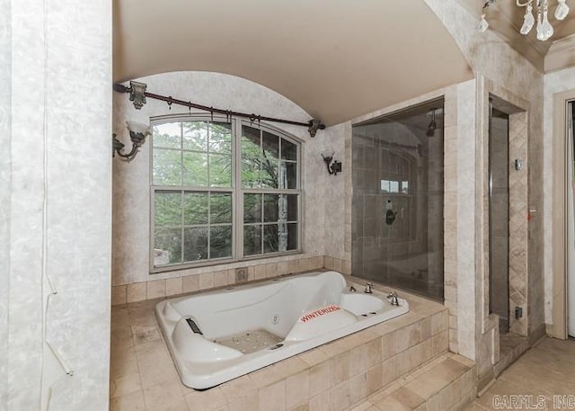 bathroom with separate shower and tub and vaulted ceiling