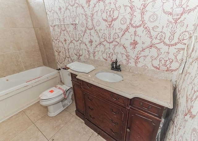 bathroom with tile patterned flooring, vanity, toilet, and a bath