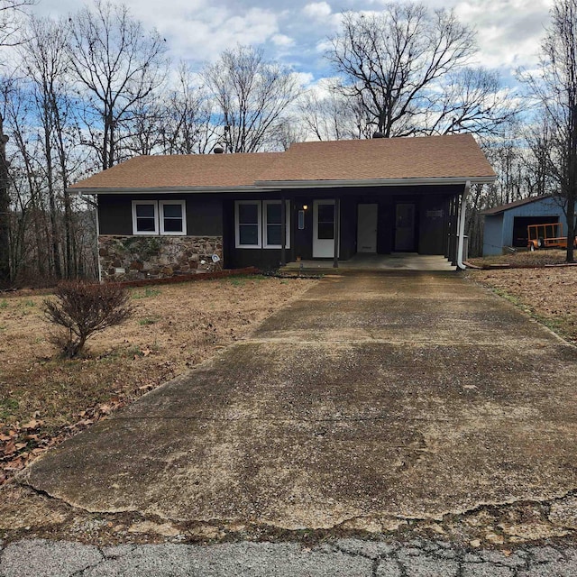 single story home featuring a carport